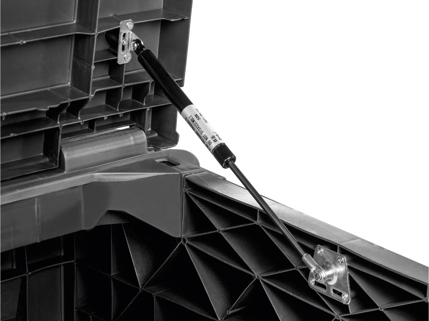 Molla a gas nera su una scatola di plastica grigia, con la scritta 'DO NOT DISASSEMBLE 50N'