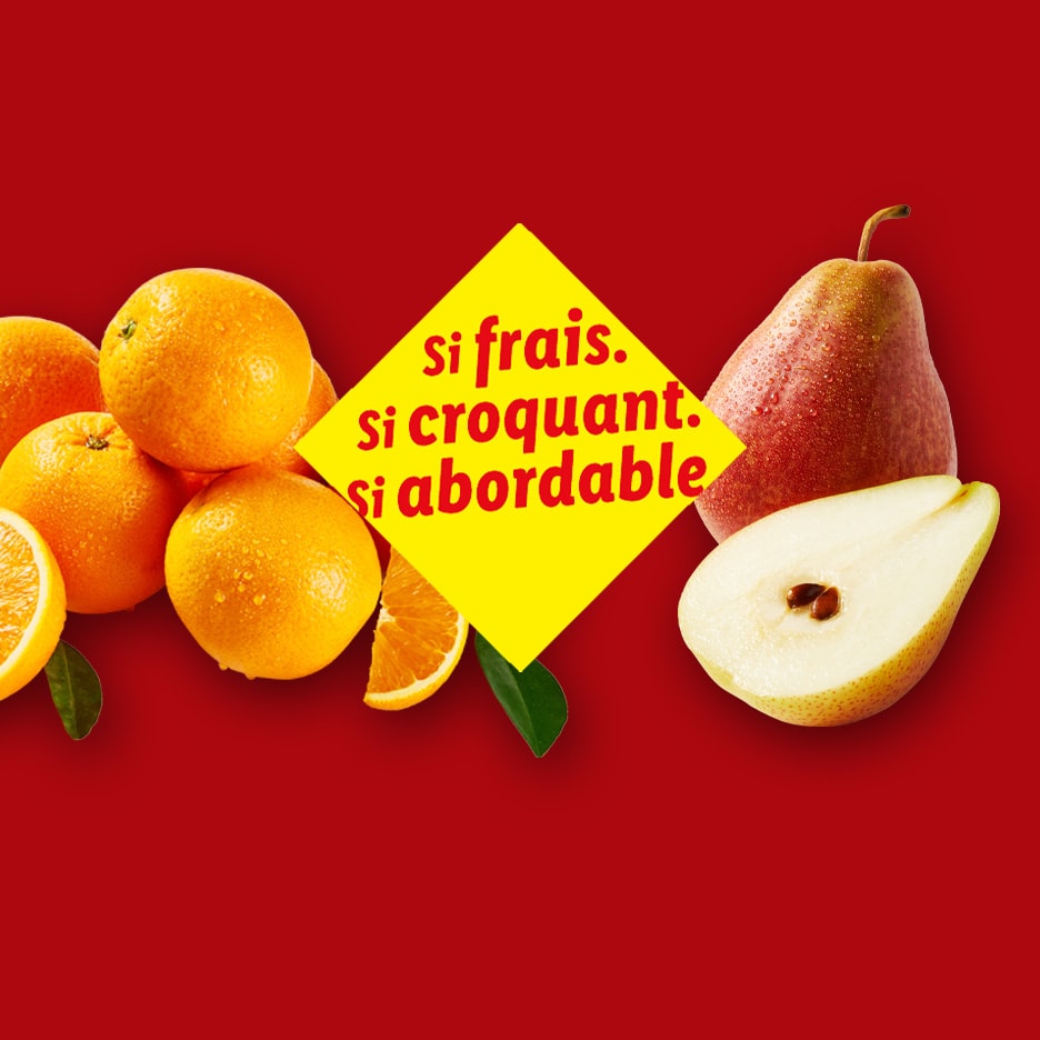 Orangen und Birnen auf rotem Hintergrund mit dem Text „so frisch, so knackig, so günstig“.