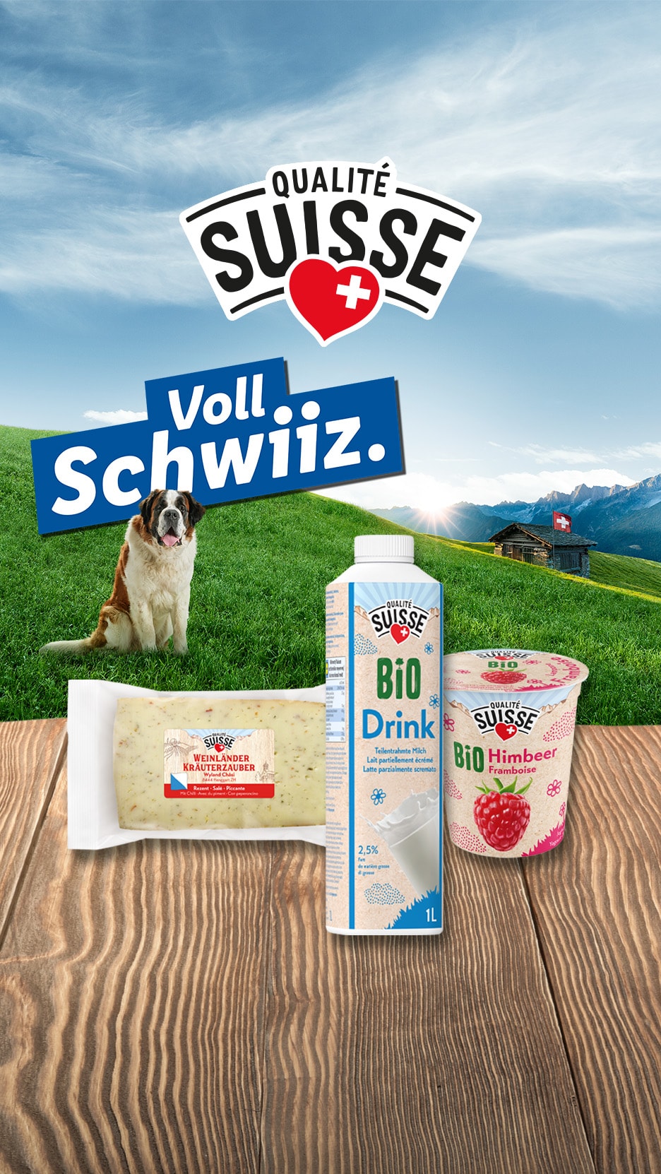 Käse, Milchgetränk und Fruchtjoghurt auf einem Holztisch, mit einem Bernhardiner und Schweizer Landschaft im Hintergrund.