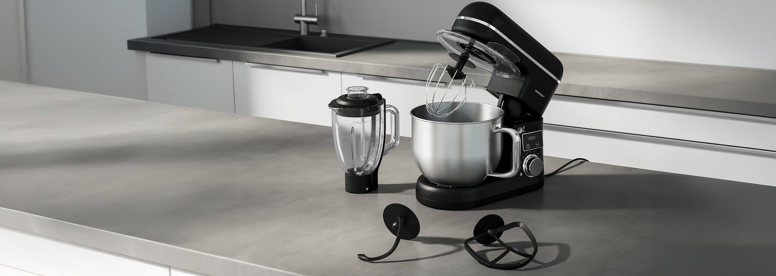 Eine Küchenmaschine und ein Stabmixer von Smeg auf einer modernen Arbeitsplatte.