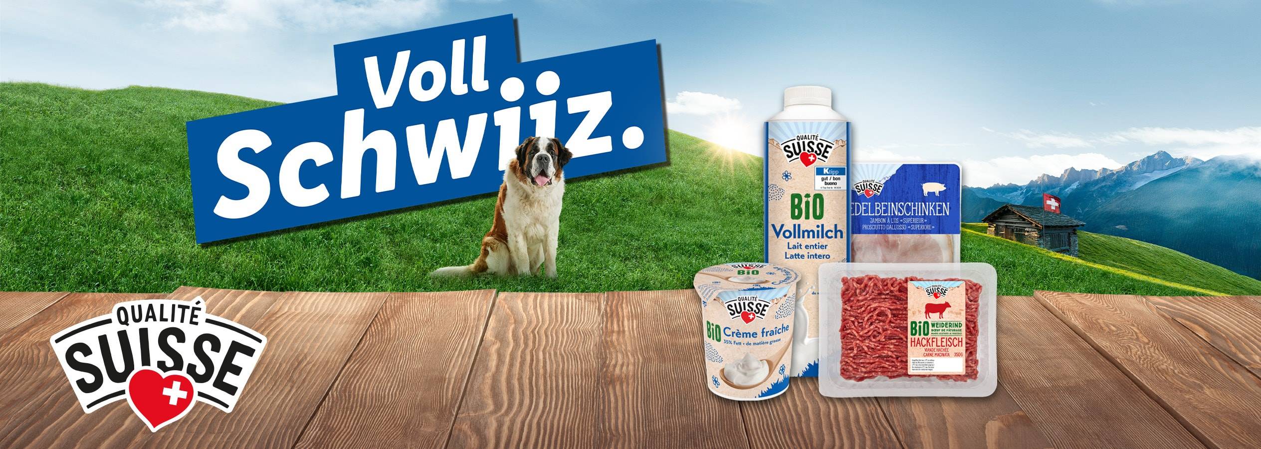 Schweizer Milchprodukte und Fleisch mit einem Bernhardiner und einer Berghütte.