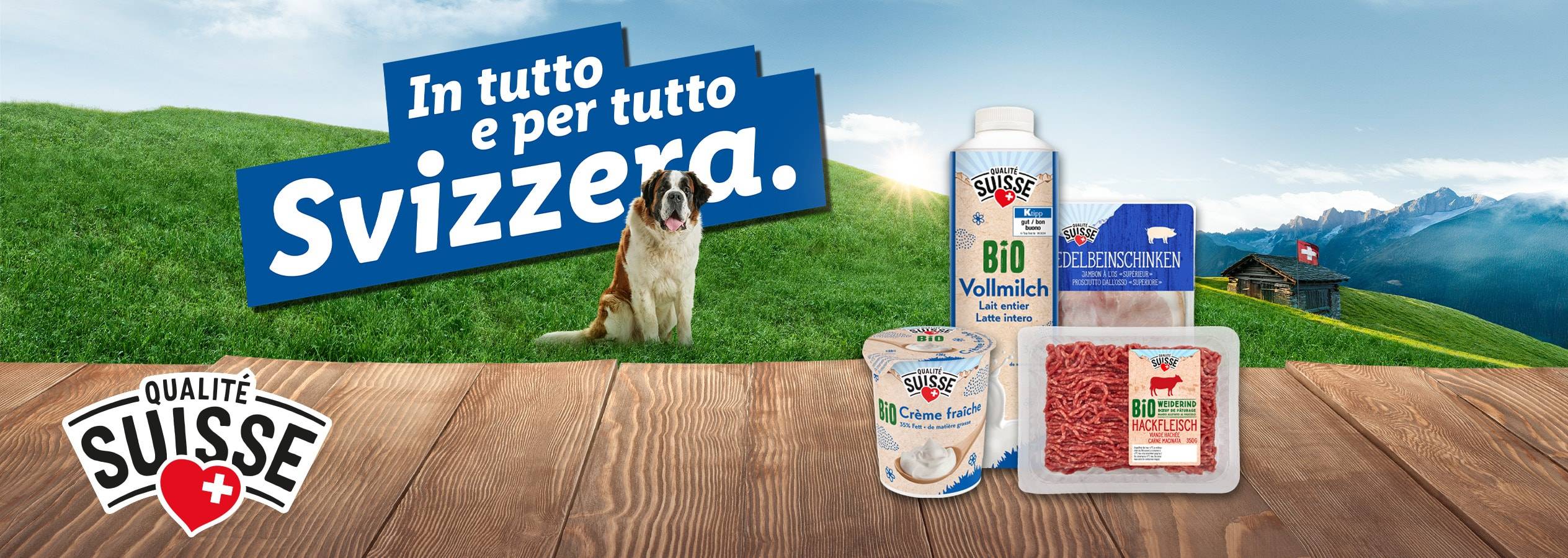 Prodotti lattiero-caseari e carne Qualité Suisse con un San Bernardo in un paesaggio alpino.