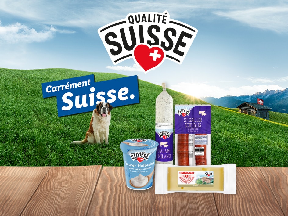 Produits suisses comme de la charcuterie, du fromage et des produits laitiers, avec un chien Saint-Bernard et un paysage alpin.