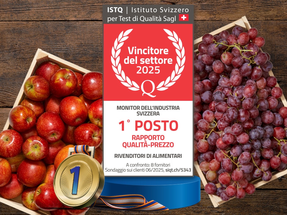 Cesto di mele rosse e uva rossa premiate come miglior rapporto qualità-prezzo 2025.