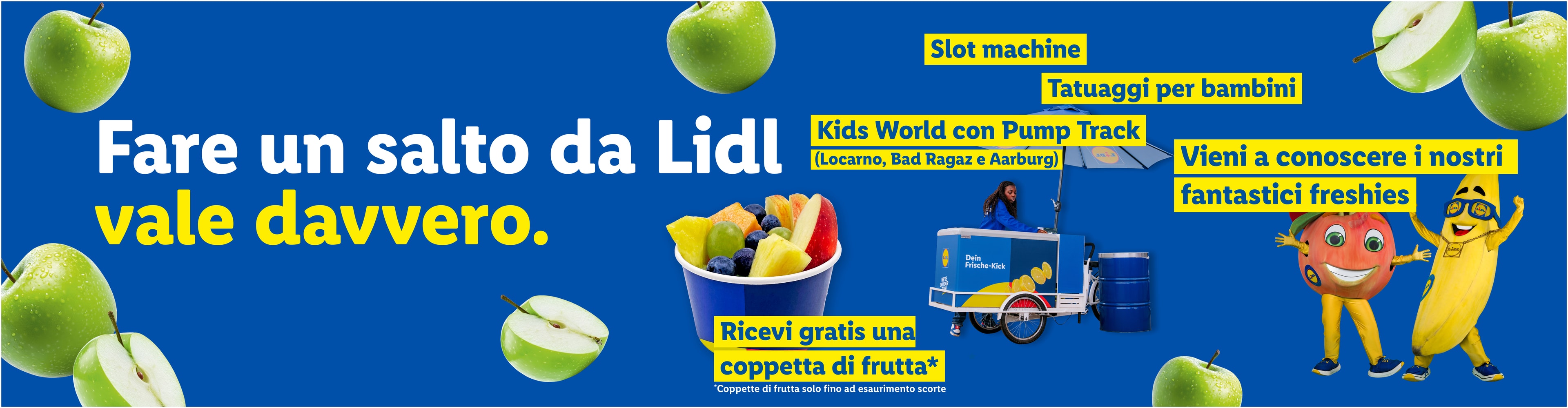 Banner promozionale con frutta, slot machine, tatuaggi per bambini e mascotte che invitano a visitare.