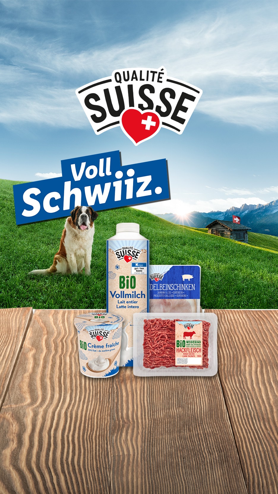 Qualité Suisse Produkte mit Milch, Schinken, Crème fraîche und Hackfleisch, vor Alpenkulisse mit Bernhardiner.