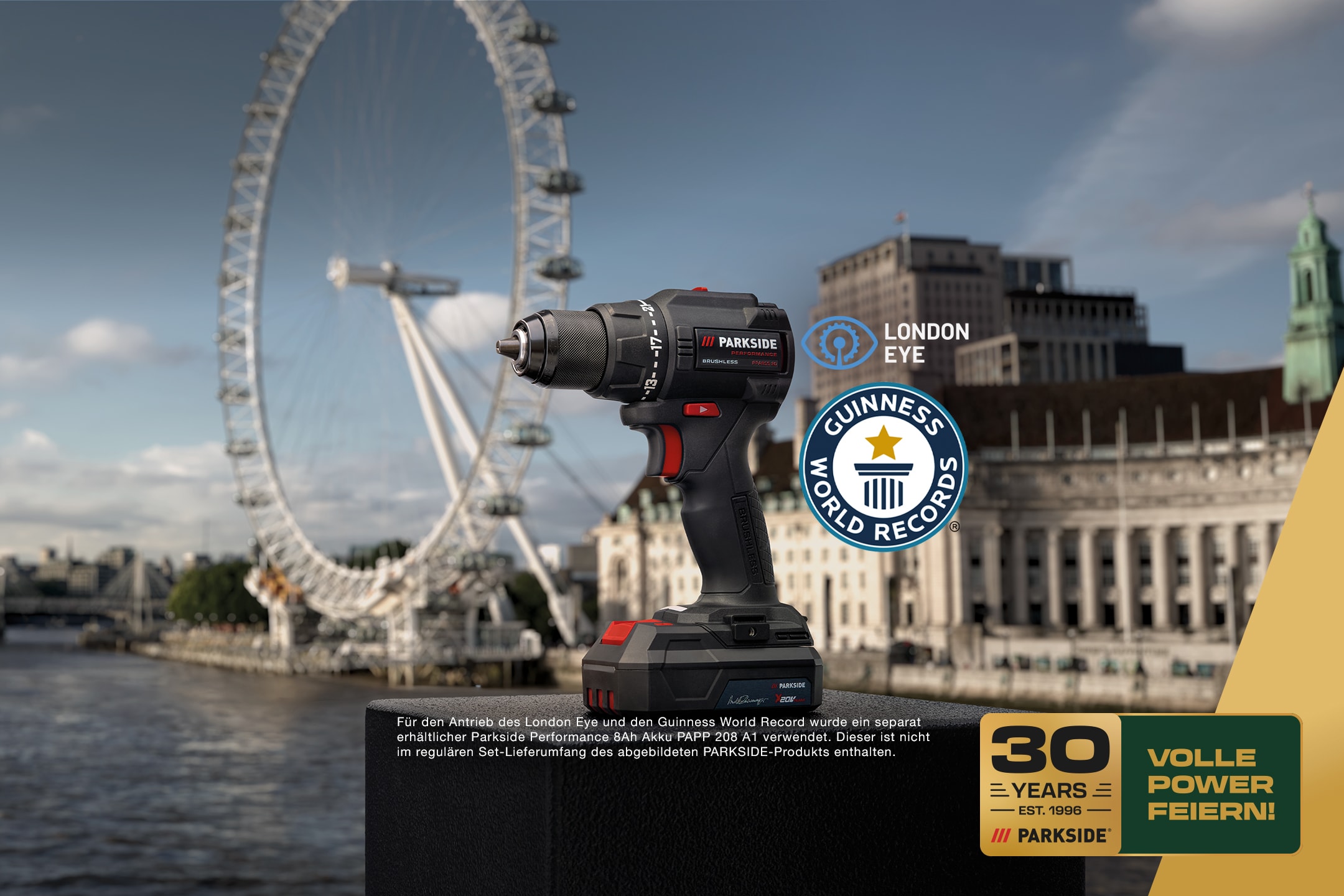 Ein Akkuschrauber vor der London Eye, mit Guinness World Records und 30 Jahre Feier-Logos.
