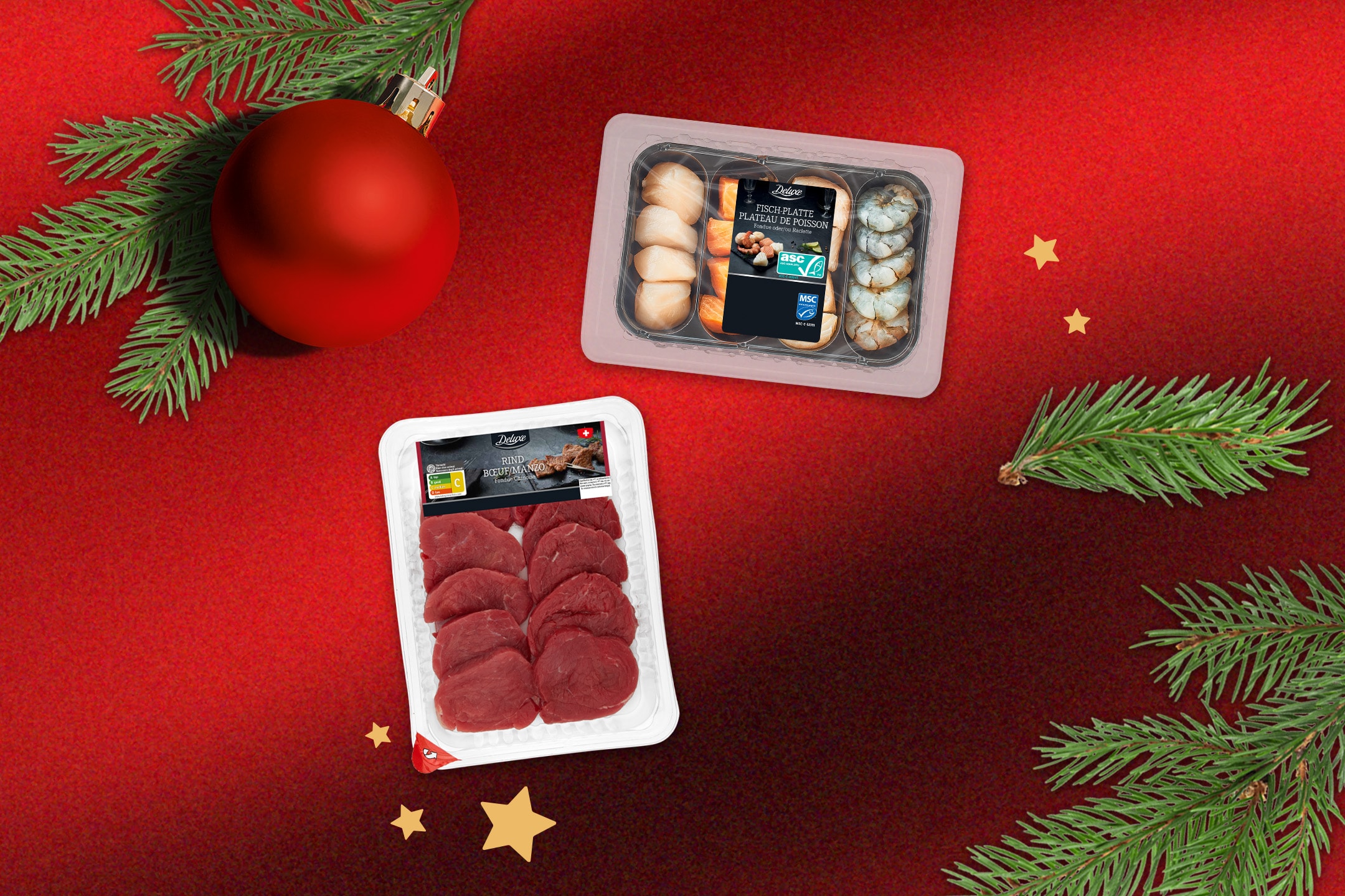 Deluxe Rind- und Fischplatten für Fondue, mit Weihnachtsdekoration.