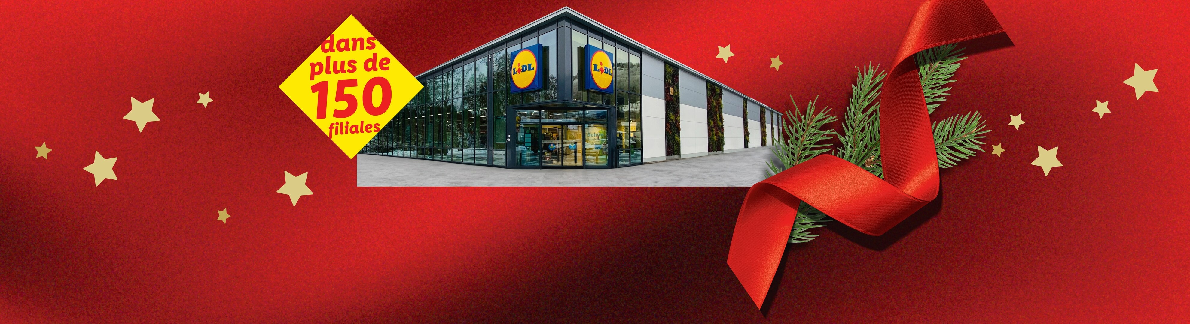 Bâtiment Lidl avec le texte 'dans plus de 150 filiales' et des décorations de Noël.