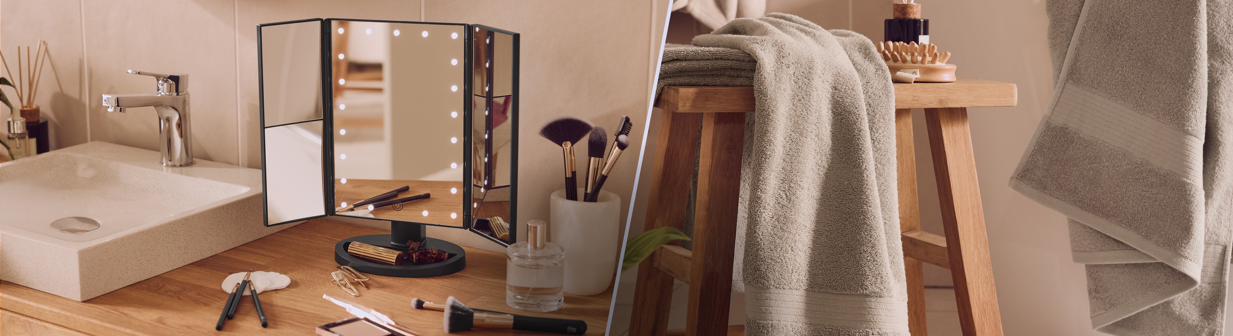 Miroir de maquillage lumineux et serviettes de bain douces dans une salle de bain moderne.