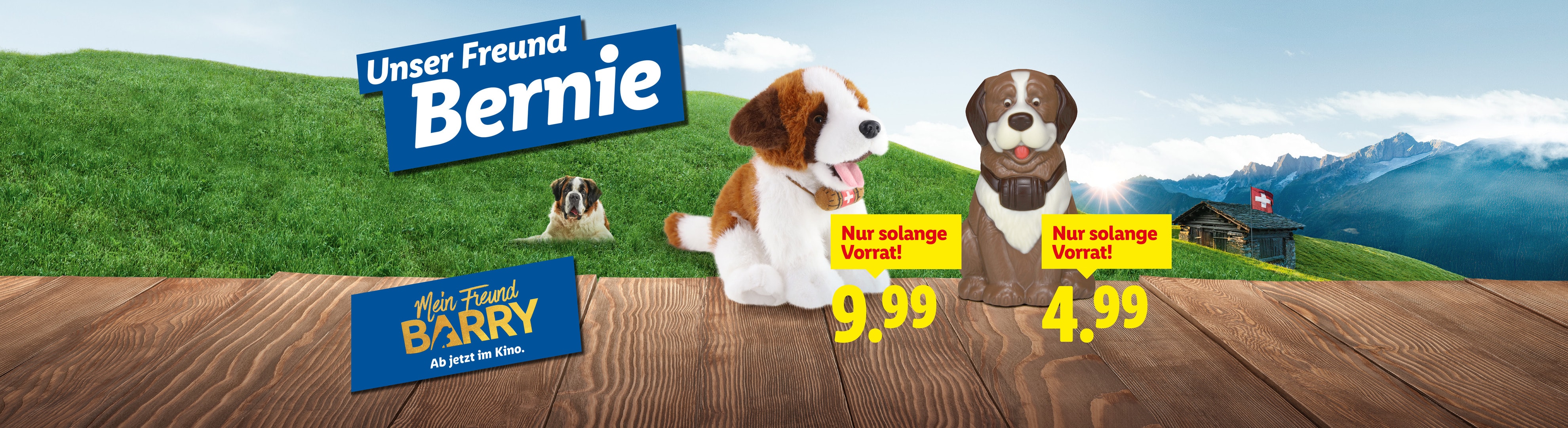 Plüschtier und Figur Bernhardiner „Bernie“ und „Barry“ mit Preisen vor Bergkulisse.