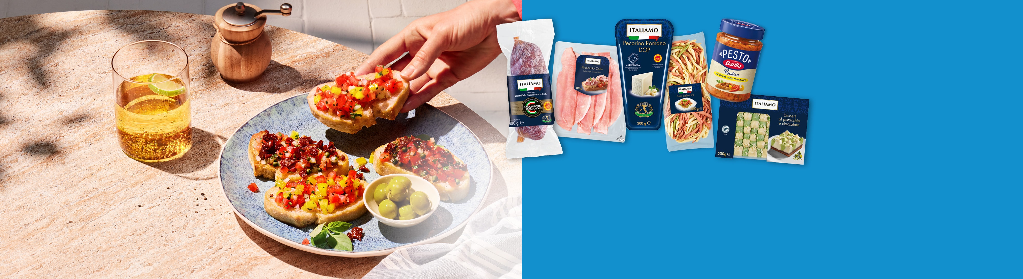 Apéritifs et produits alimentaires italiens tels que bruschetta, charcuterie, fromage, pâtes et pesto.