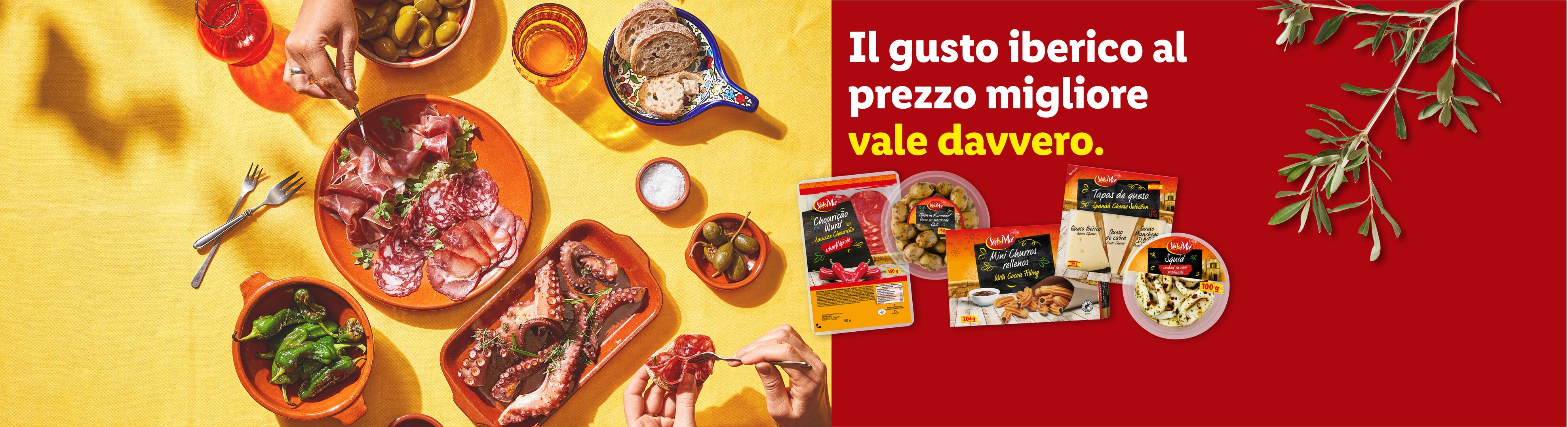 Un tavolo imbandito con salumi, polpo, peperoni e olive, con prodotti confezionati e il testo 'Il gusto iberico al prezzo migliore vale davvero.'