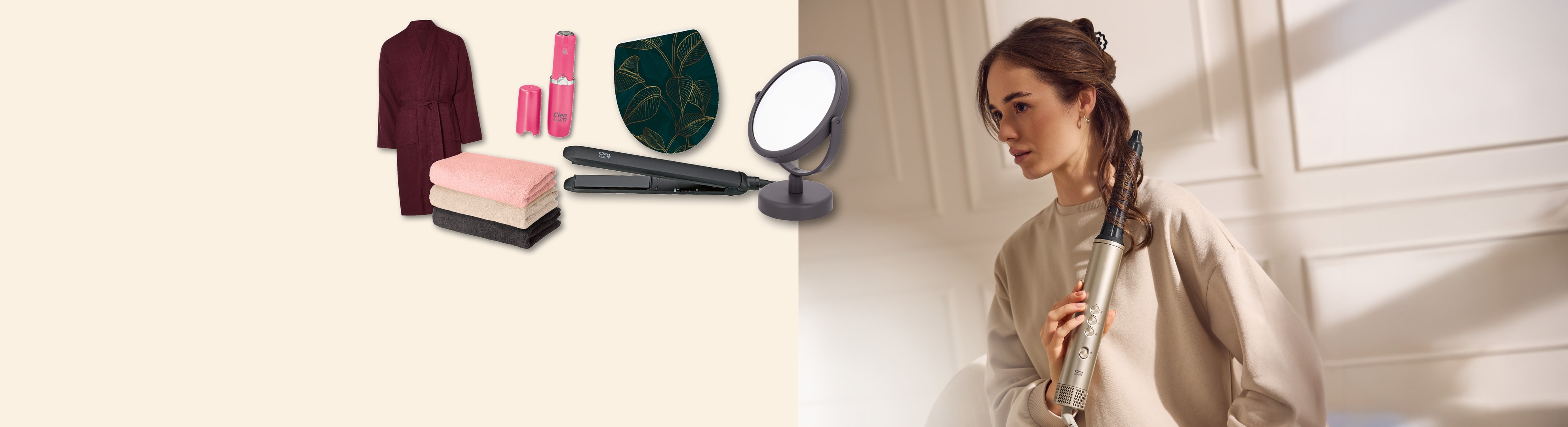 Bademantel, Handtücher, Haarglätter, Spiegel und eine Frau, die ihre Haare stylt.