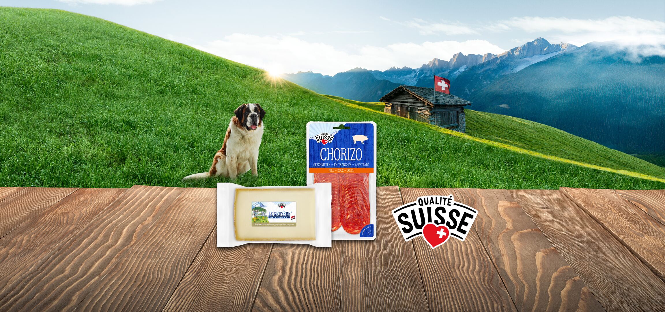 Chorizo, Gruyère svizzero e pere sullo sfondo di un paesaggio svizzero.