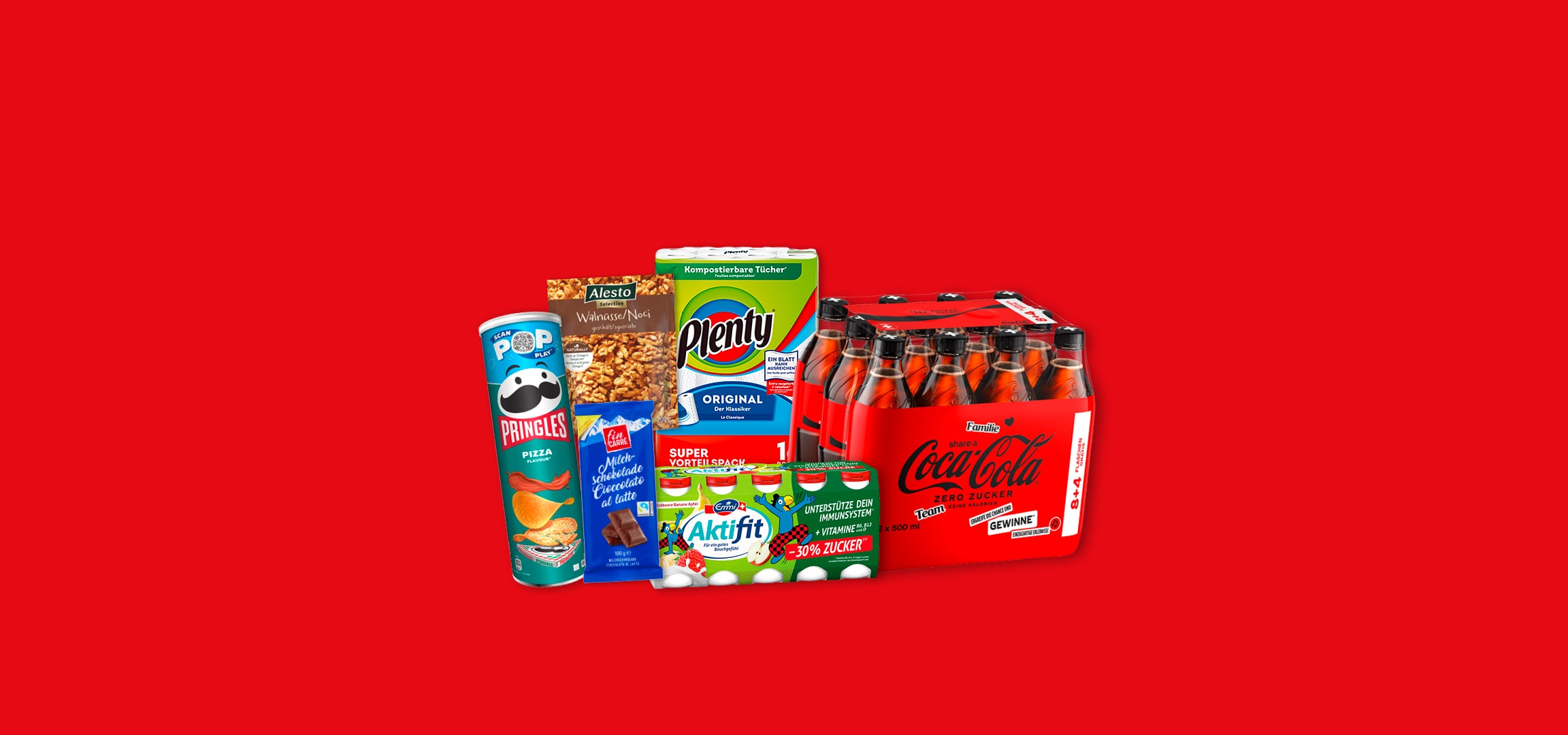 Pringles Chips, Alesto Walnüsse, Plenty Toilettenpapier, Schokolade und Coca-Cola Getränke.