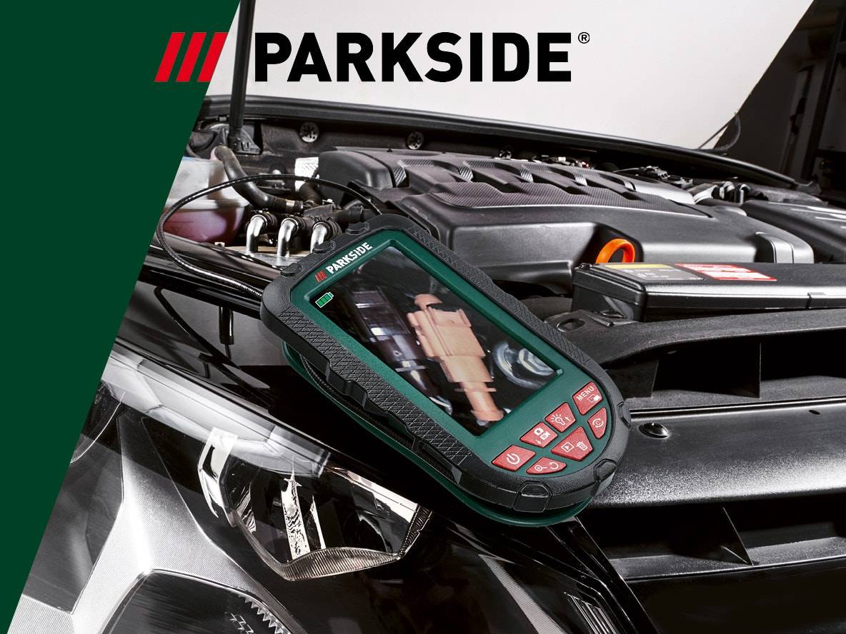 Endoskopkamera mit Display, die zur Inspektion eines Automotors verwendet wird.