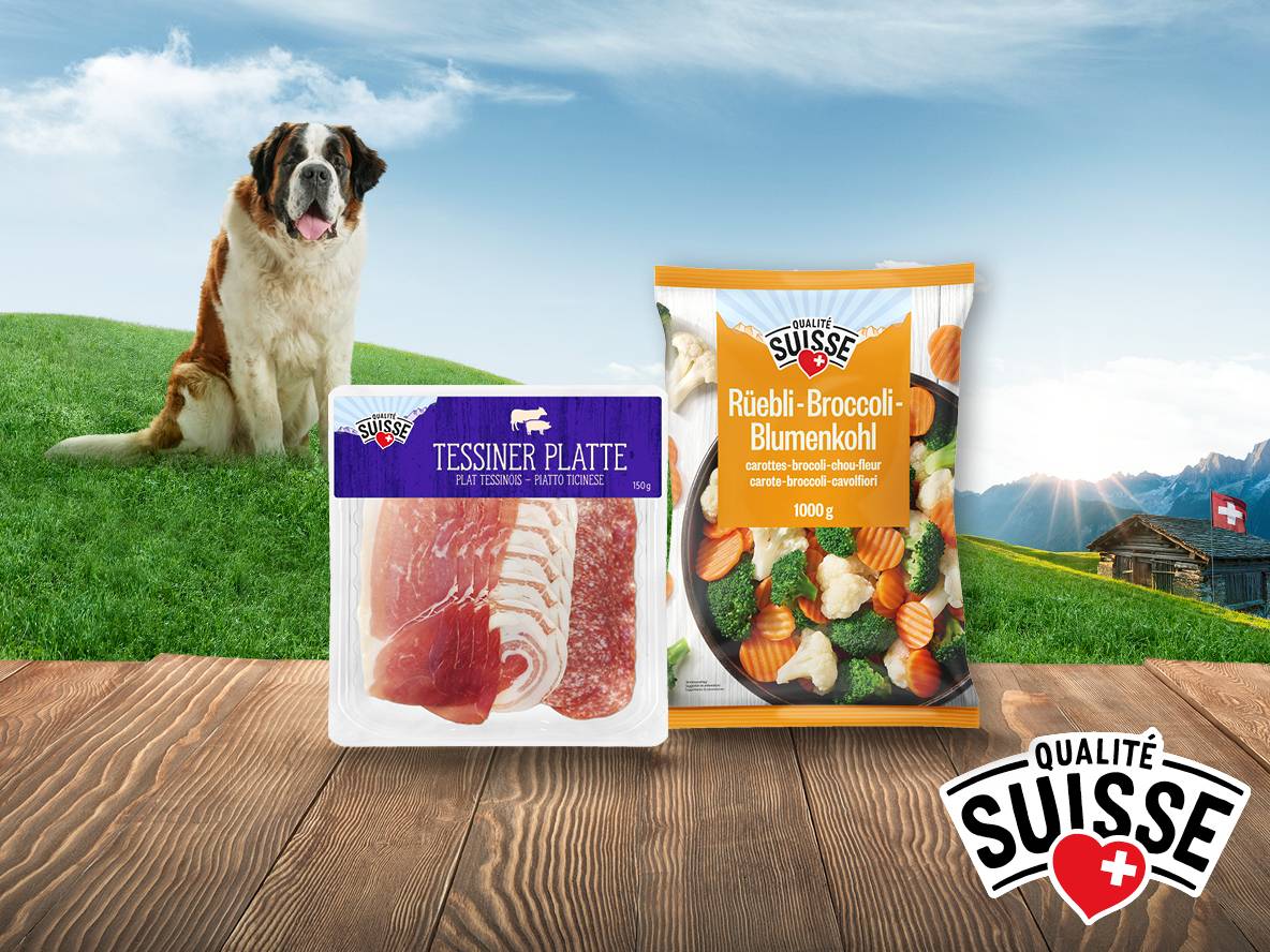 Tessiner Platte und Rüebli-Broccoli-Blumenkohl von Qualité Suisse mit Bernhardiner und Alpenlandschaft.